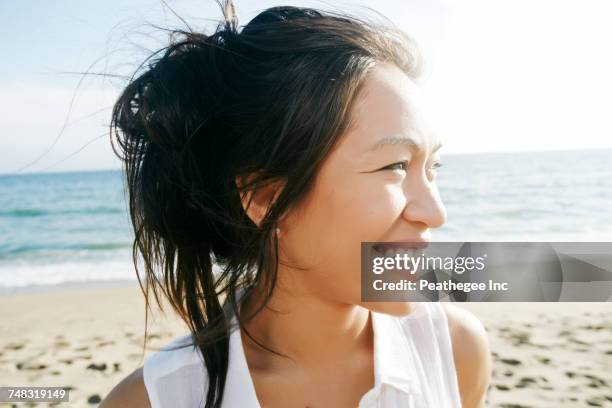 portrait of vietnamese woman at beach smiling - vietnamese ethnicity stock pictures, royalty-free photos & images