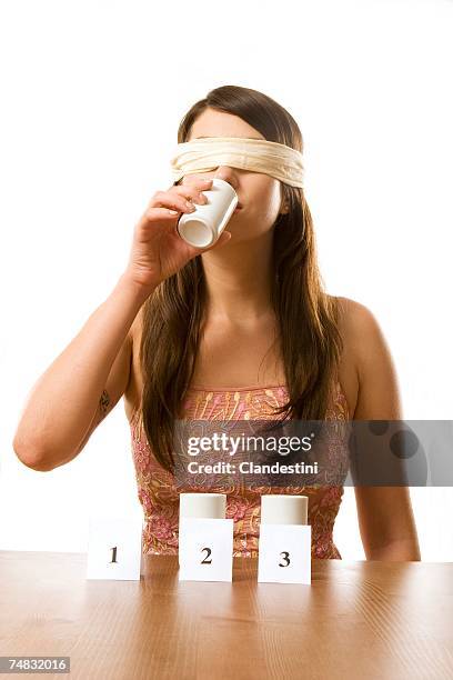 young woman in blindfold participated in taste test, portrait - blind fold stock pictures, royalty-free photos & images