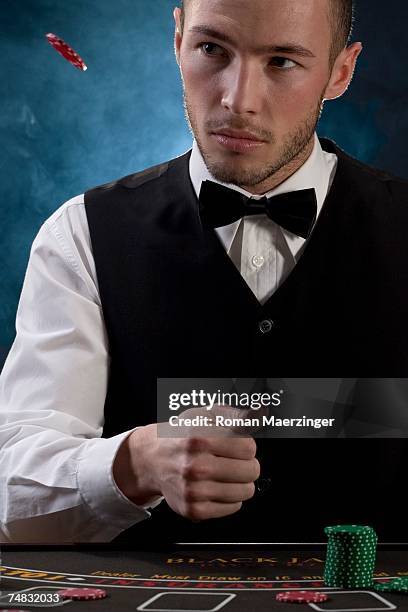man throwing away chip - casino worker stock pictures, royalty-free photos & images