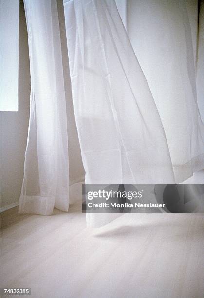 blowing white curtain - curtains blowing stock pictures, royalty-free photos & images