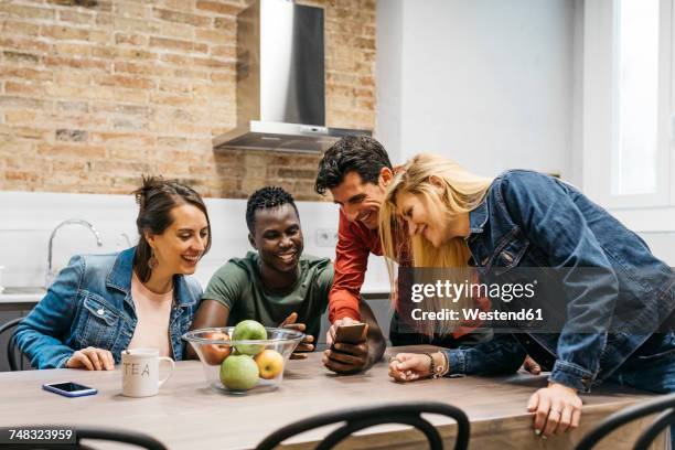 colleagues having a break in office kitchen - staffroom stock pictures, royalty-free photos & images