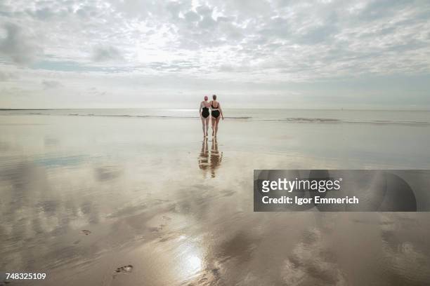 mother and daughter heading to sea, folkestone, uk - folkestone stock pictures, royalty-free photos & images