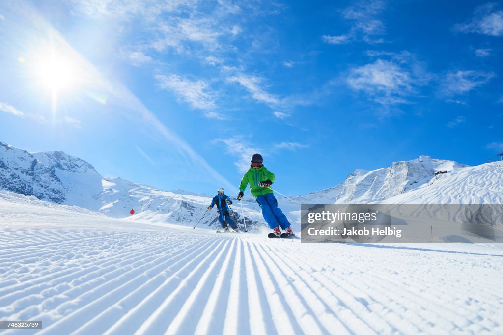 Father and son on skiing holiday, Hintertux, Tirol, Austria