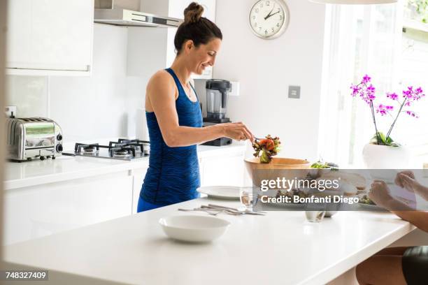 woman preparing salad lunch - salad tossing stock pictures, royalty-free photos & images