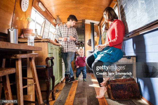 family with baby boy living on barge - narrow kitchen stock pictures, royalty-free photos & images