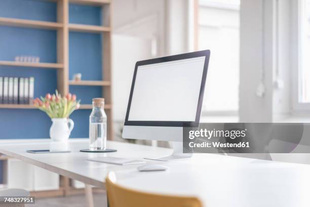 workplace in a loft - empty water bottle stock pictures, royalty-free photos & images