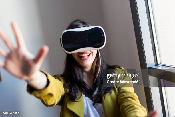 happy woman wearing vr glasses - nerd stock pictures, royalty-free photos & images