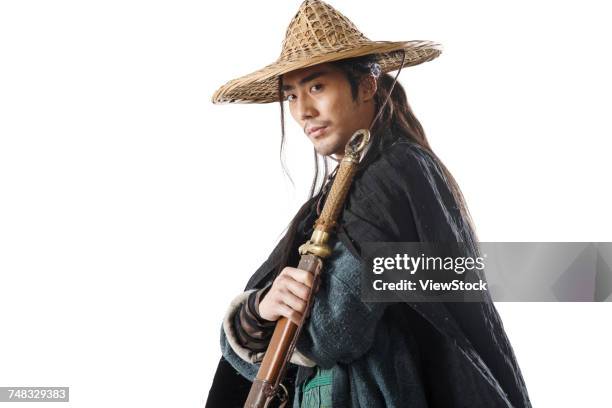 a swordsman - asian style conical hat fotografías e imágenes de stock