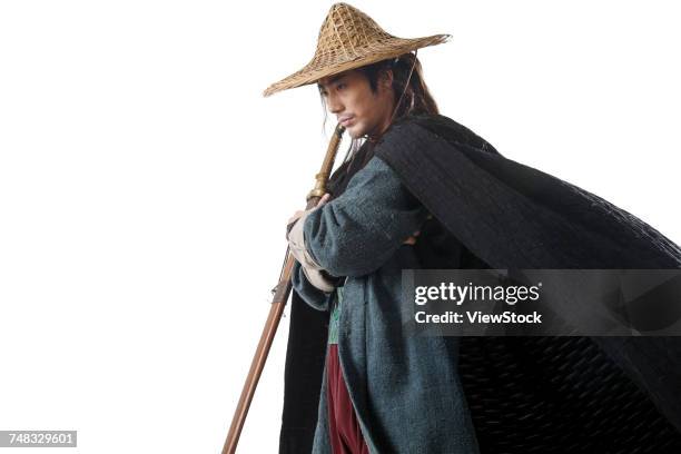 a swordsman - asian style conical hat fotografías e imágenes de stock