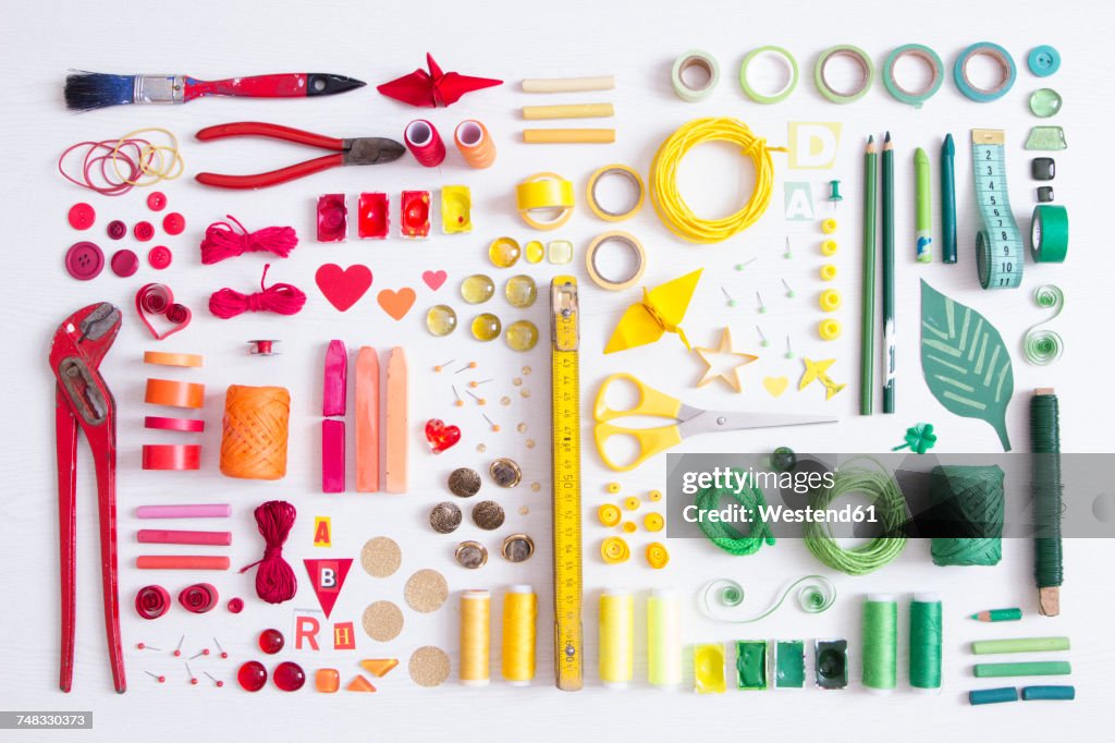 Tools, craft and painting materials on white ground