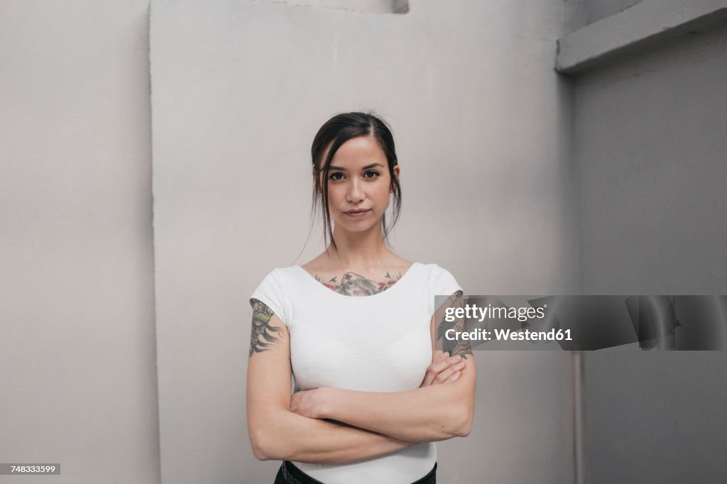 Portrait of a young woman with tattoos