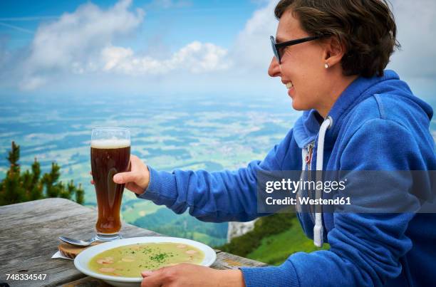 germany, chiemgau, happy hiker on hochfelln with glass of beer and dish of pea soup - pea soup stock pictures, royalty-free photos & images