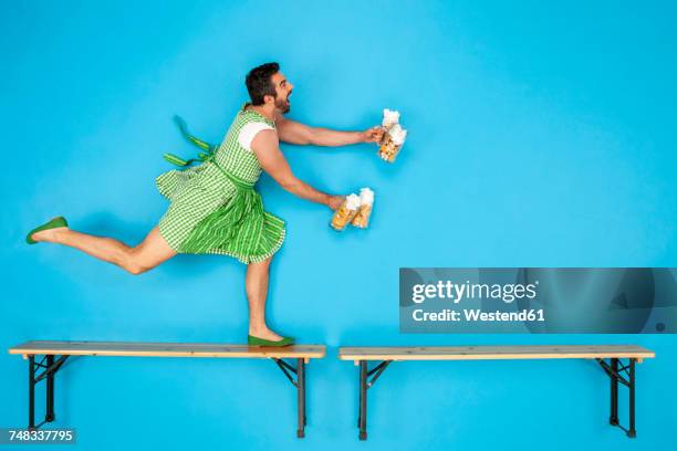 cross-dressed man serving beer at the beer fest - crossdressed stock pictures, royalty-free photos & images