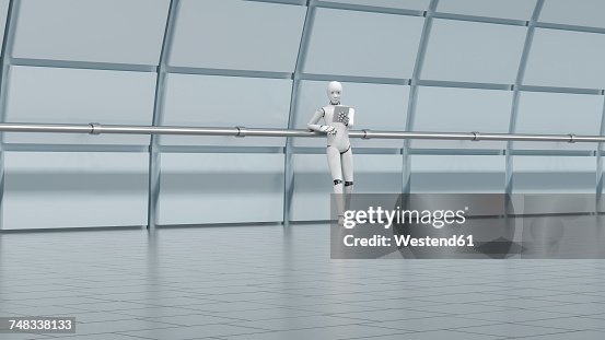 Robot standing in hall, using digital tablet Robot standing in hall, using digital tablet