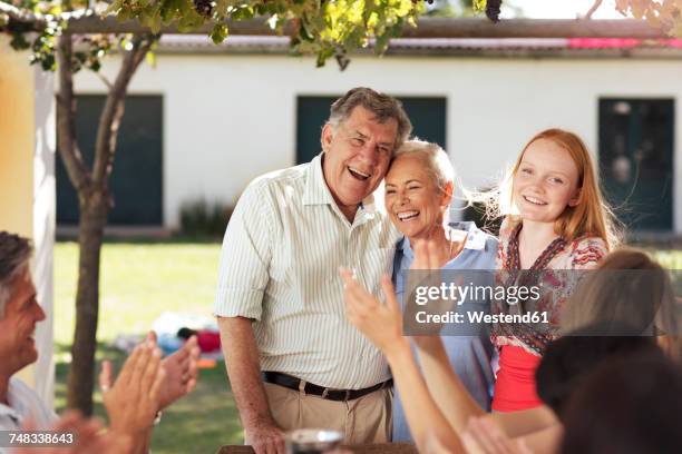 happy senior couple with family having lunch together outside - happy anniversary stock pictures, royalty-free photos & images