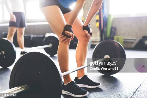 close-up of woman with barbell in gym - sports glove stock pictures, royalty-free photos & images