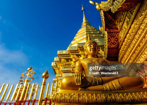 thailand, chiang mai, temple wat phra that doi suthep, ornate golden statue and chedi - chiang mai province stock pictures, royalty-free photos & images