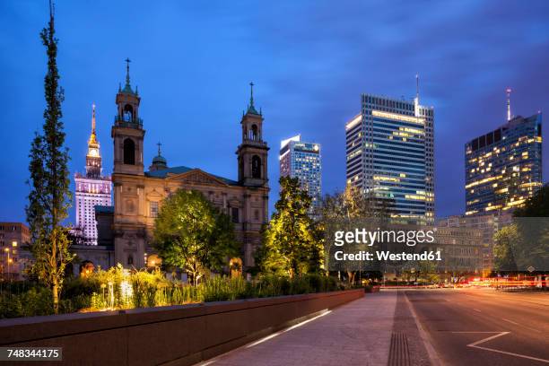 poland, warsaw, city centre night skyline with all saints church and skyscrapers, downtown cityscape - warsaw ストックフォトと画像