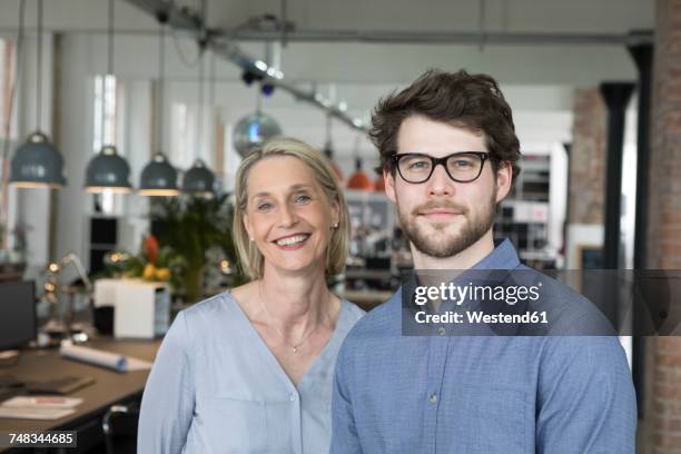 portrait of a young businessman and mature a businesswomen - founder of kids company camila batmanghelidjh leaves lbc studios stockfoto's en -beelden