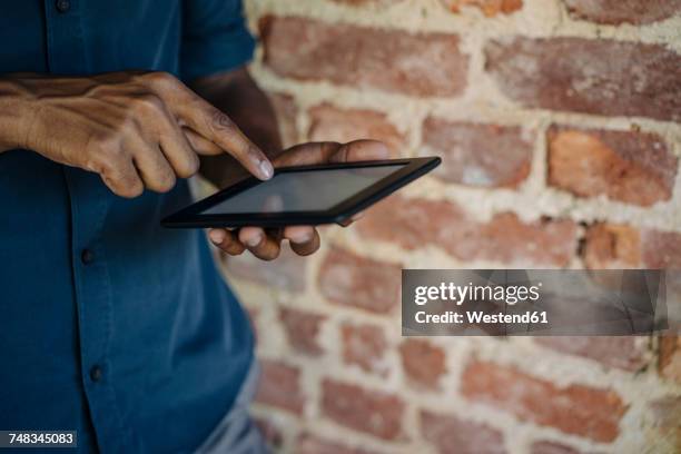 close-up of businessman using tablet - middle finger stock-fotos und bilder