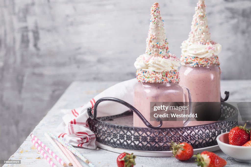 Unicorn shake with cream and chocolate-covered cone