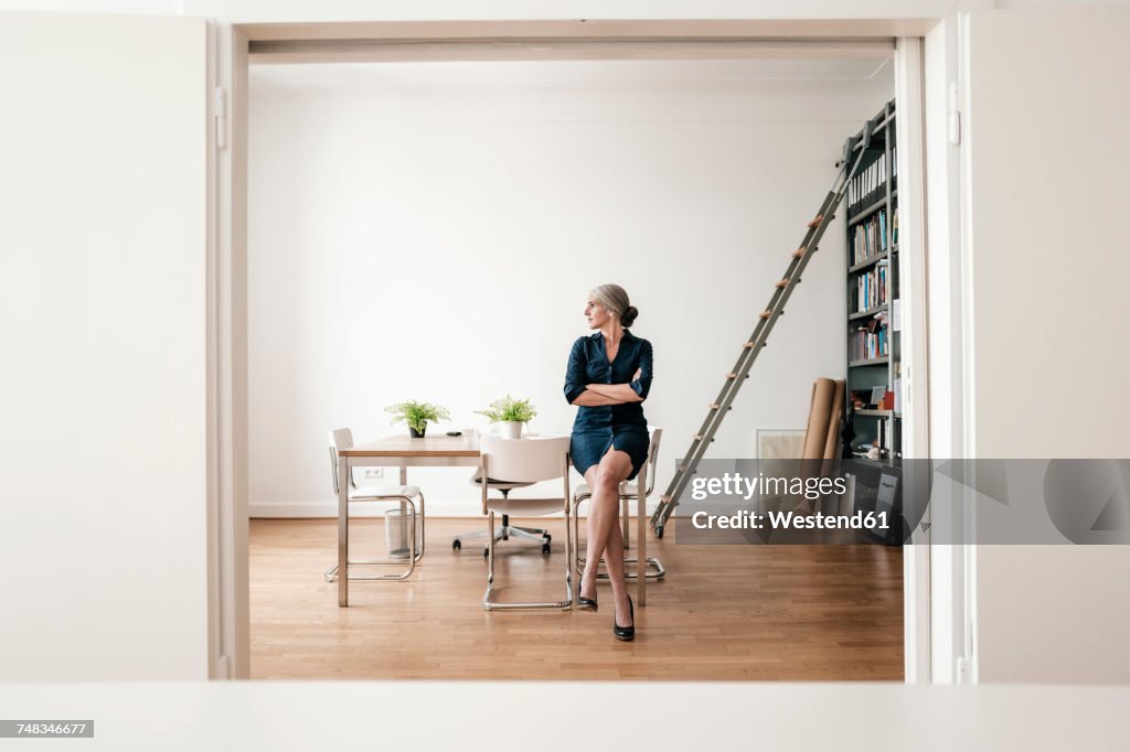 Businesswoman sitting in modern office