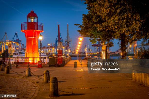 germany, hamburg, oevelgoenne, view to harbour at night - bollard stock-fotos und bilder