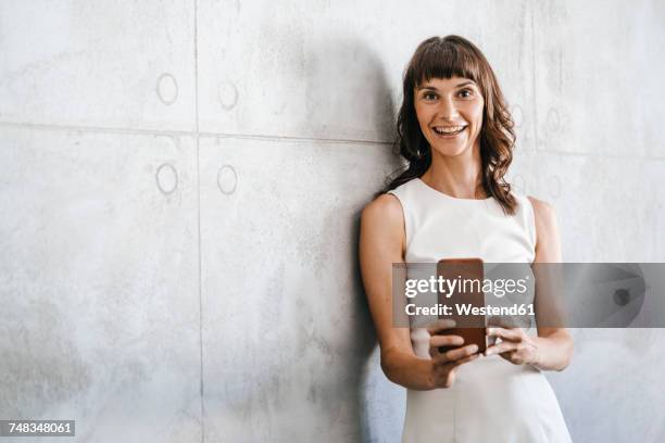 businesswoman taking selfie in office - geschäftsfrau kleid stock-fotos und bilder