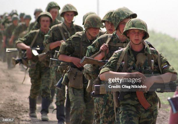 Russian soldiers prepare for a raid against Chechen rebels April 29, 2000 in the mountains near the village of Orekhovo in southern Chechnya. Chechen...