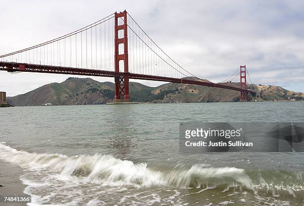 Small wave crashes against the shore near the Golden Gate Bridge June 20, 2007 in San Francisco. Pacific Gas and Electric has launched an estimated...