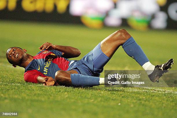 Samuel Eto'o of FC Barcelona falls during the PSL soccer match between the Sundowns and FC Barcelona at Loftus Versfeld stadium on June 20, 2007 in...