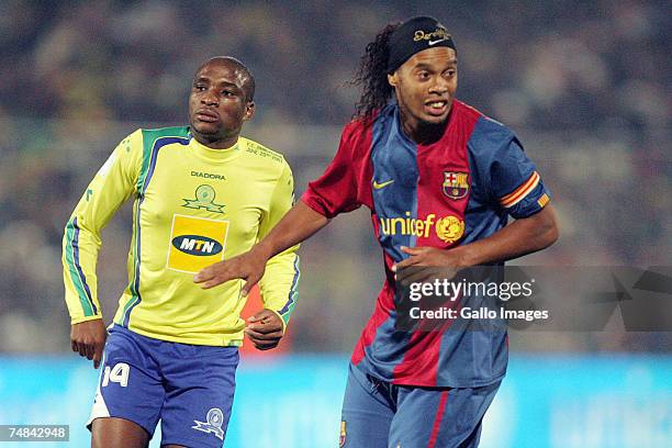 Surprise Moriri of Sundowns and Ronaldinho of FC Barcelona in action during the PSL soccer match between the Sundowns and FC Barcelona at Loftus...