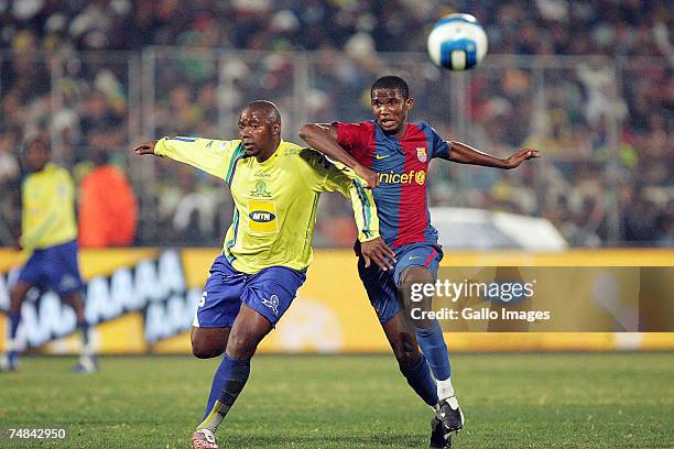 Oldjohn Mabizela of Sundowns and Samuel Eto'o of FC Barcelona in action during the PSL soccer match between the Sundowns and FC Barcelona at Loftus...