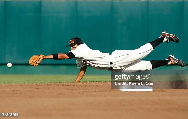 Second baseman Joey Wong of the Oregon State Beavers dives for a ground ball during their 7-1 win over the UC Irvine Anteaters in Game 12 of the NCAA...