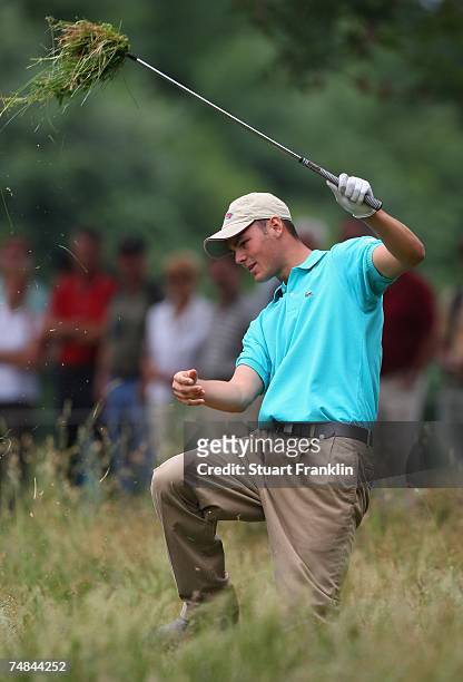 Martin Kaymer of Germany plays out of deep rough on the seventh hole during the first round of The BMW International Open Golf at The Munich North...