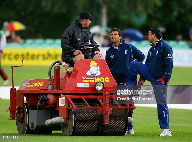 Vikram Solanki and Kabir Ali chat to the groundsman as the weather delays the start of the England Lions One Day match against the West Indies at New...