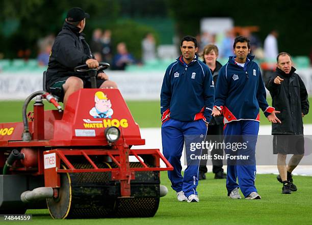 Vikram Solanki and Kabir Ali chat to the groundsman as the weather delays the start of the England Lions One Day match against the West Indies at New...