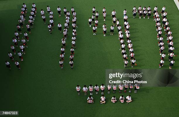 One hundred and fifty students line "1997" during an event to mark the upcoming 10th anniversary of Hong Kong Special Administrative Region June 21,...