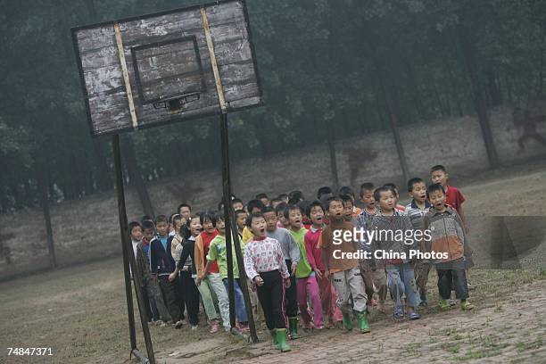 Rural students take part in a physical education class at a Project Hope primary school June 20, 2007 on the outskirts of Liaocheng of Shandong...