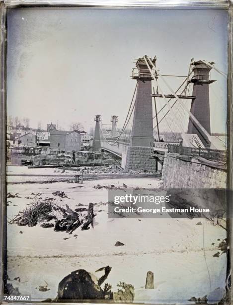 Tinted daguerreotype of the second Niagara Falls Suspension Bridge shortly before its completion, Niagra Falls, Ontario & New York, early 1855. The...