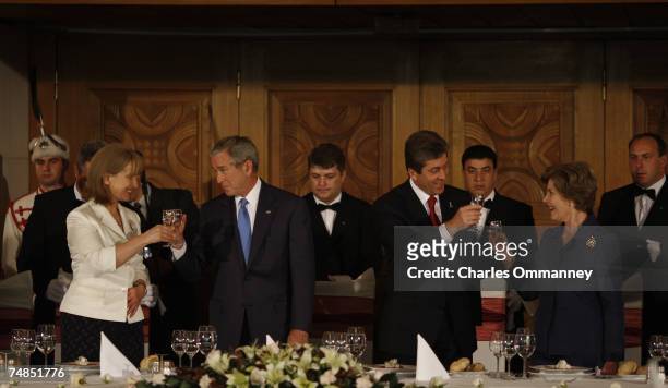 President George W. Bush and First Lady Laura Bush toast attendees during an social lunch with Bulgarian President Georgi Parvanov and Bulgarian...