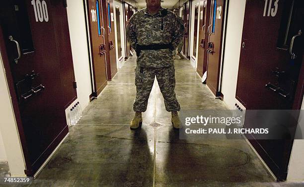 In this 24 April 2007 file photo, a guard inside the maximun security Camp 5 at Camp Delta in Guantanamo Bay Naval Station, Cuba, stands his post in...