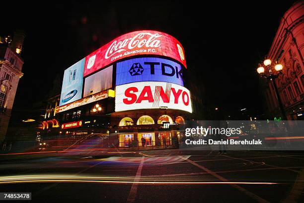 Traffic moves through Piccadilly Circus as the landmark advertising lights are turned bback on after the Capital 95.8 Light Out London Campaign on...