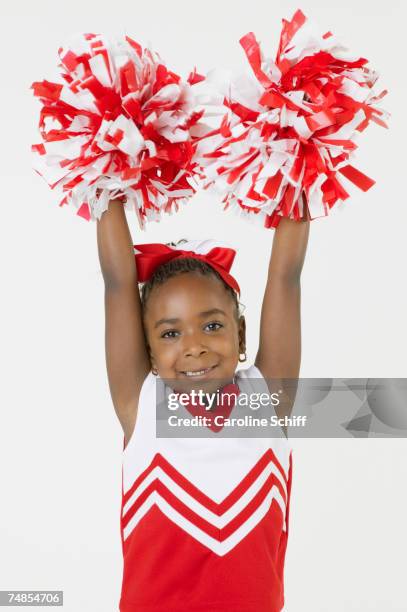 african girl dressed as cheerleader - pom pom stock-fotos und bilder