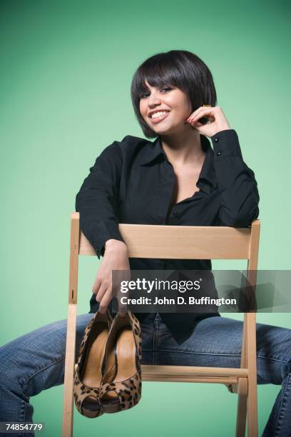 kuwaiti woman holding pair of shoes - legs spread woman stock pictures, royalty-free photos & images