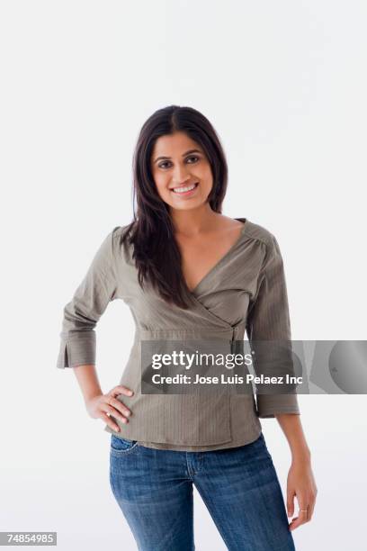 indian woman with hand on hip - jeans isolated stock pictures, royalty-free photos & images