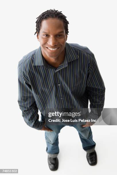 african man with hands in pockets - men body confidence stock pictures, royalty-free photos & images