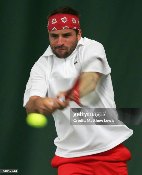 Arnaud Clement of France in action against Richard Gasquet of France during the Quarter Final match at the ATP Nottingham Open at the City of...