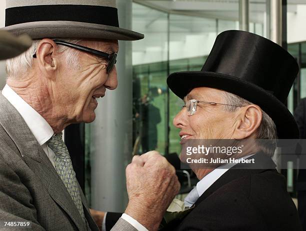 Former jockey Lester Piggott is greeted by former jockey and tv pundit Willie Carson as he arrives at Ascot Racecourse on the fourth day of The Royal...