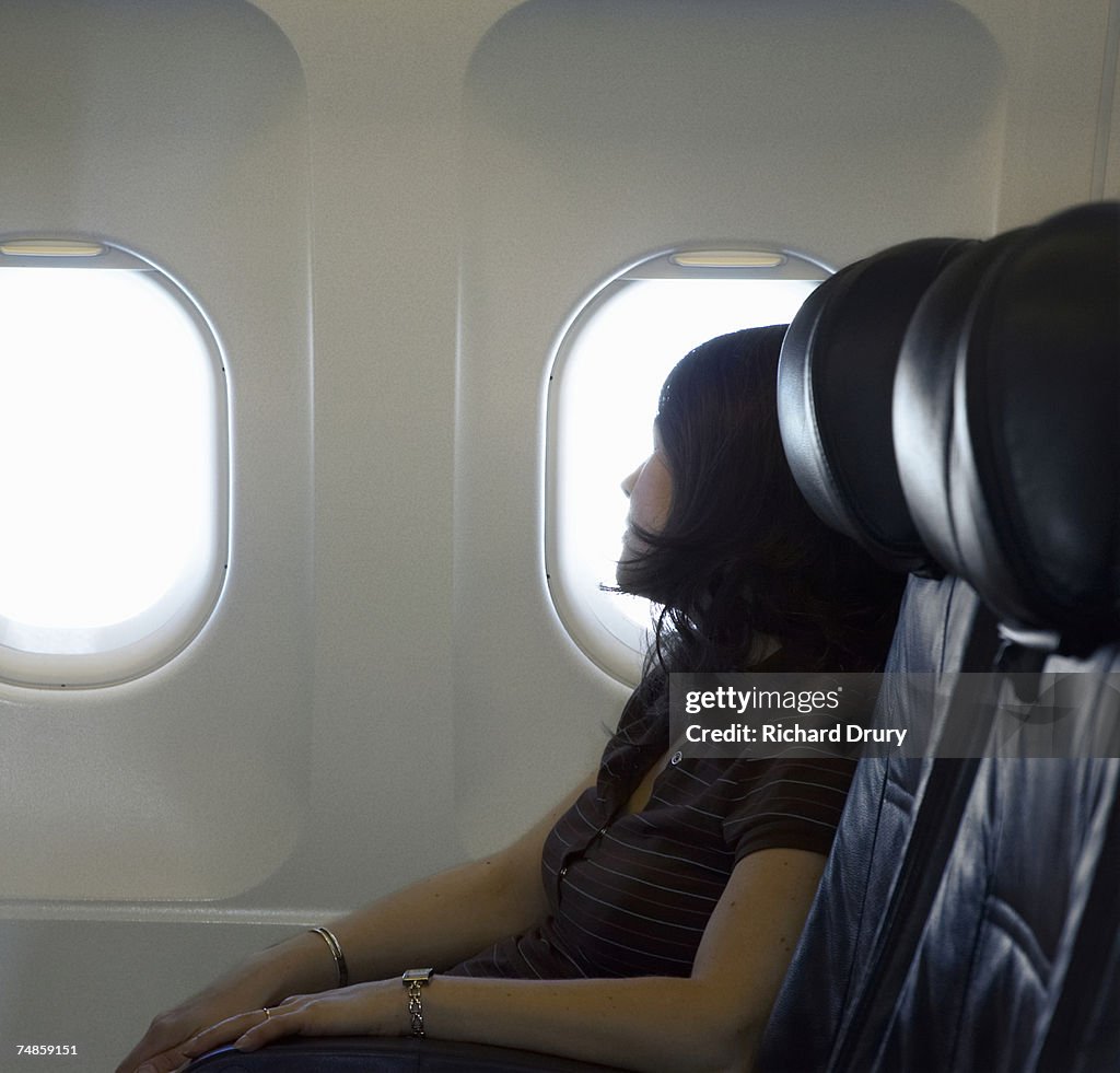 Woman passenger sleeping on airplane